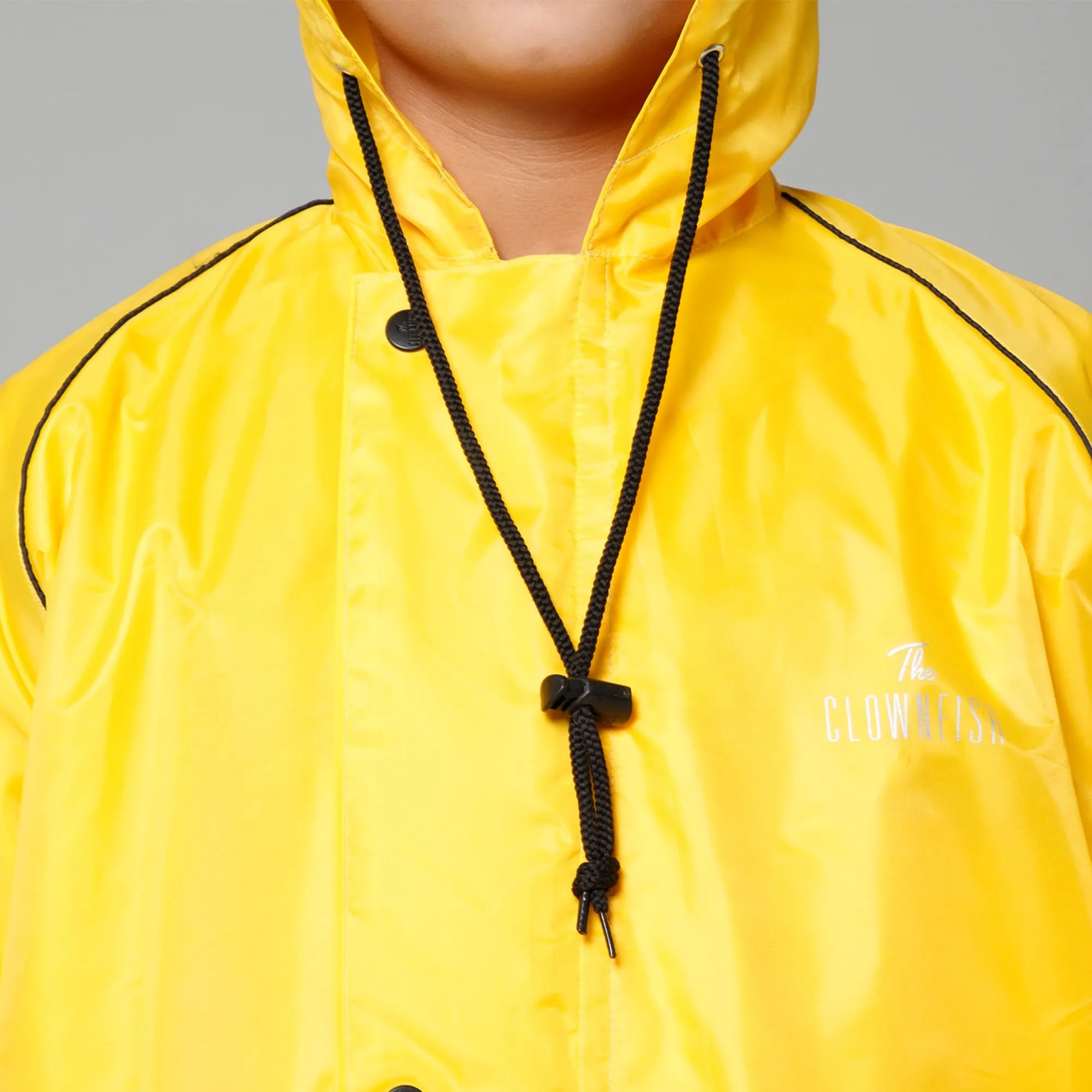 THE CLOWNFISH Duke Series Kids Waterproof Polyester Double Coating Reversible Raincoat with Hood and Reflector Logo at Back. Set of Top and Bottom. Printed Plastic Pouch. Kid Age-14-16 years (Yellow)