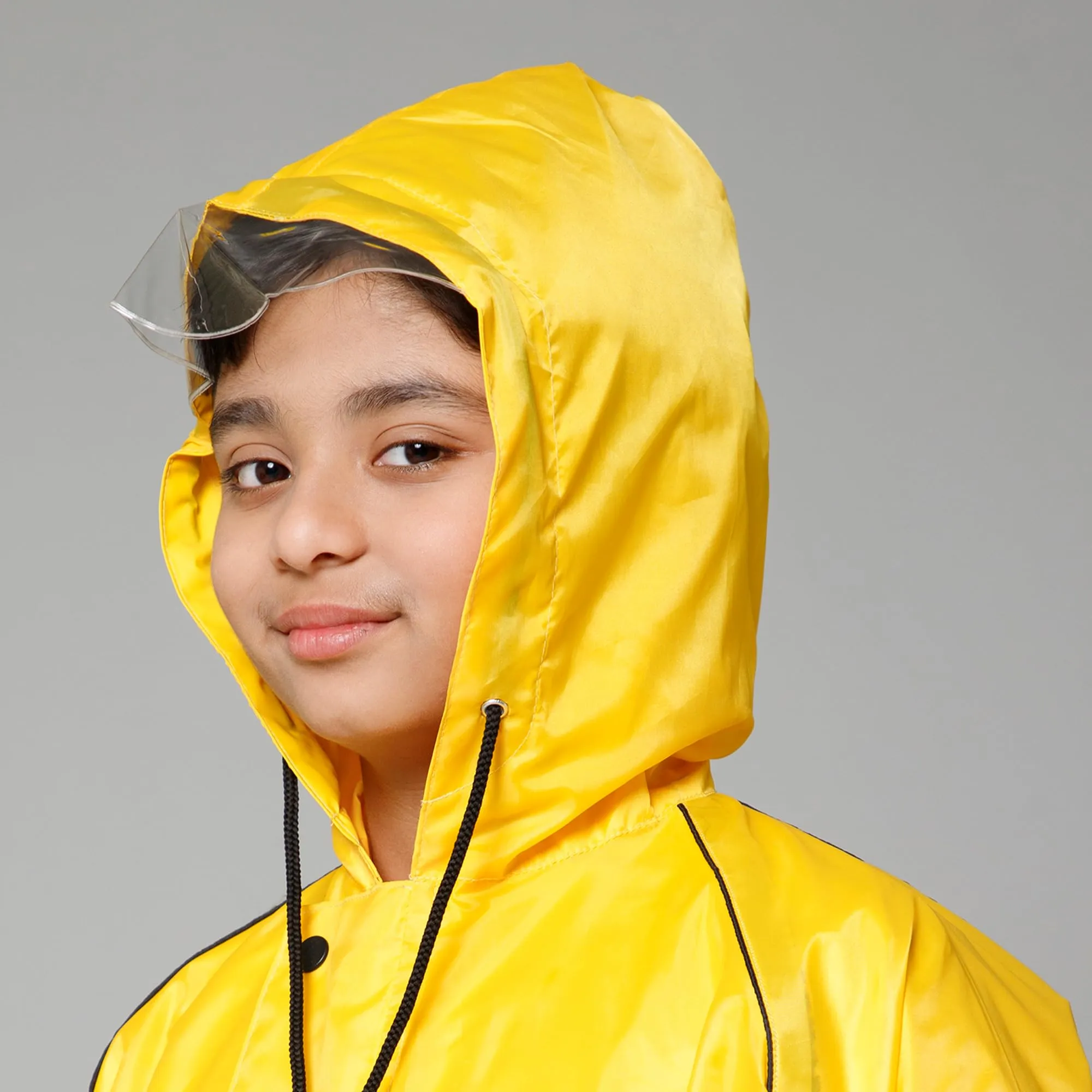 THE CLOWNFISH Duke Series Kids Waterproof Polyester Double Coating Reversible Raincoat with Hood and Reflector Logo at Back. Set of Top and Bottom. Printed Plastic Pouch. Kid Age-14-16 years (Yellow)