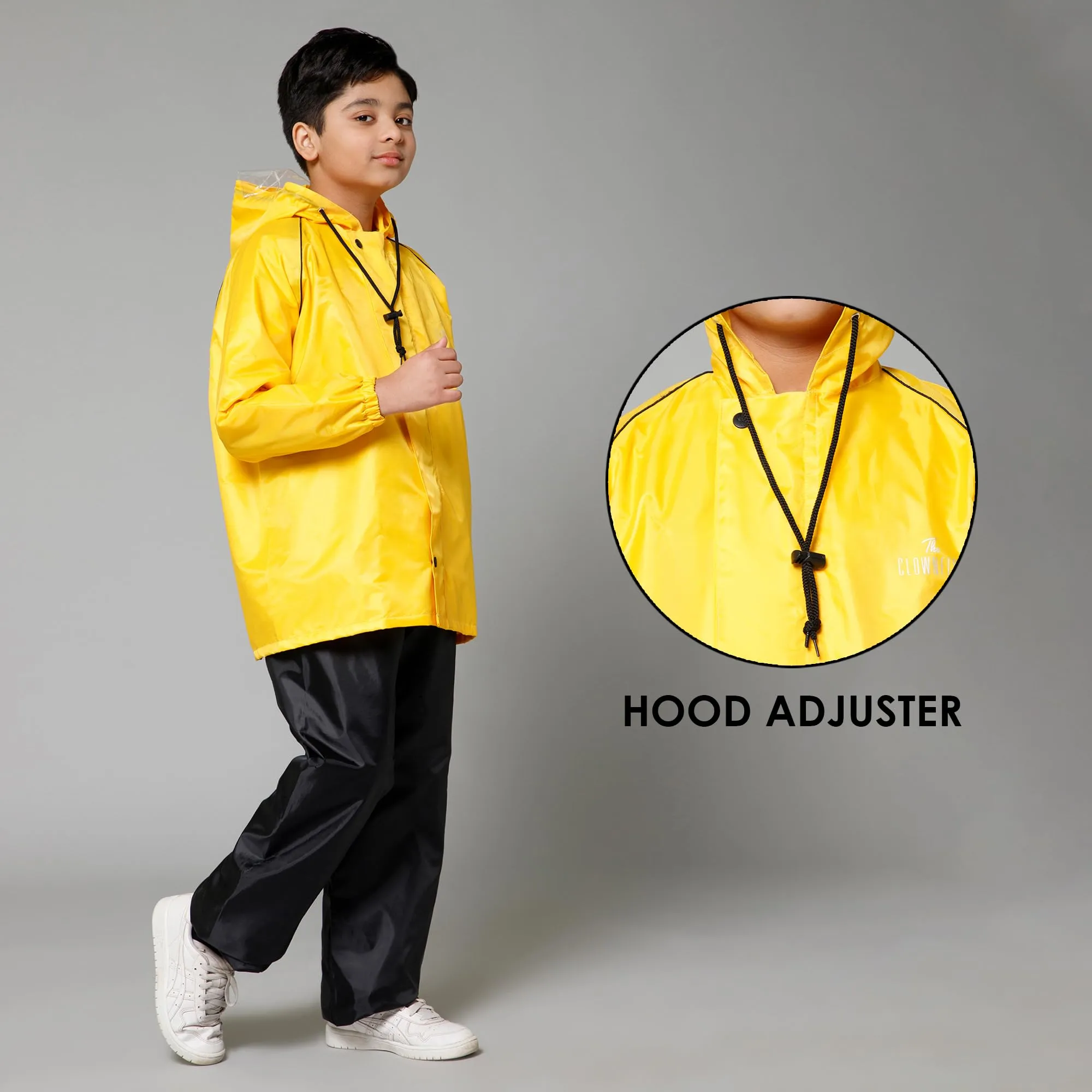 THE CLOWNFISH Duke Series Kids Waterproof Polyester Double Coating Reversible Raincoat with Hood and Reflector Logo at Back. Set of Top and Bottom. Printed Plastic Pouch. Kid Age-14-16 years (Yellow)