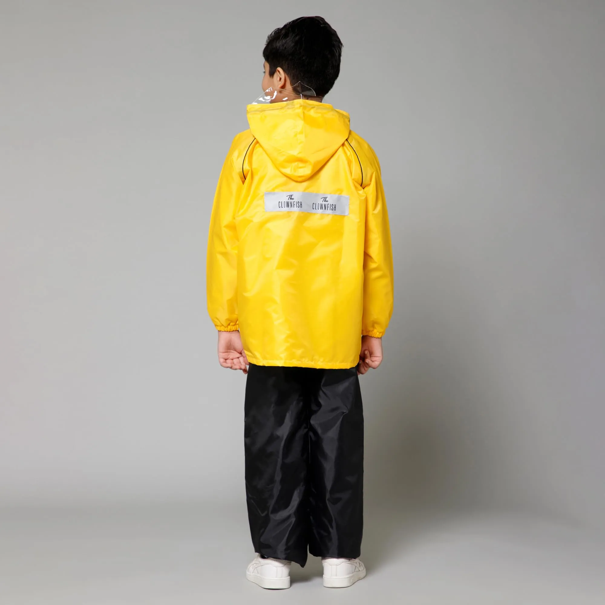 THE CLOWNFISH Duke Series Kids Waterproof Polyester Double Coating Reversible Raincoat with Hood and Reflector Logo at Back. Set of Top and Bottom. Printed Plastic Pouch. Kid Age-14-16 years (Yellow)