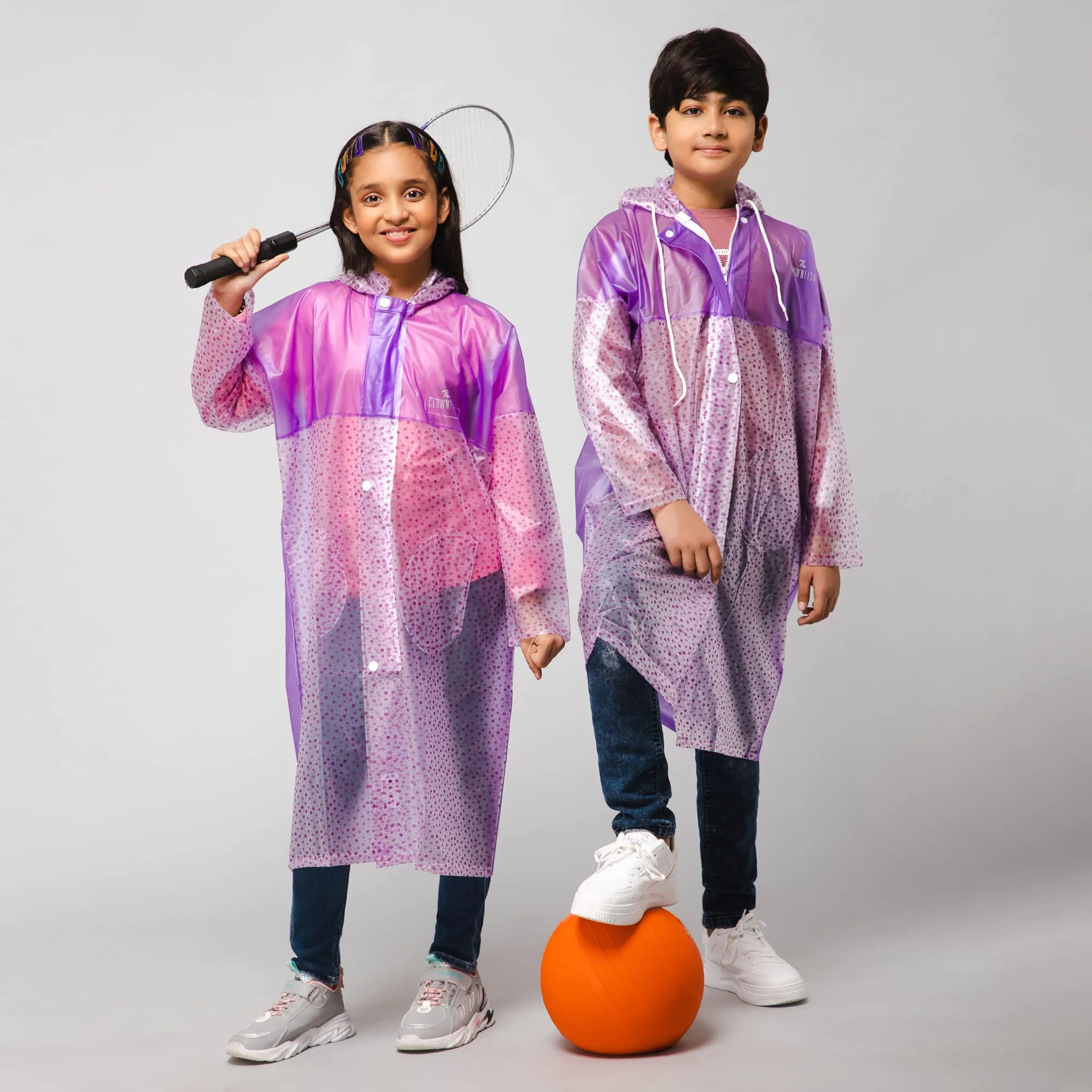 THE CLOWNFISH Misty Magic Series Unisex Kids Waterproof Single Layer PVC Longcoat/Raincoat with Adjustable Hood. Age-6-7 Years (Purple)